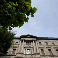 The Bank of Japan’s headquarters in Tokyo. The central bank looks set to end this fiscal year well behind on its target for government bond purchases. Bank of Japan's bid to taper by stealth made tougher by supercharged yen