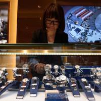 An employee arranges Seiko Watch Corp.’s Grand Seiko brand watches at the company’s Seiko Premium Boutique store, in the upscale Ginza shopping district of Tokyo on Feb. 28. With luxury push, Japan gives Swiss watch-making industry a run for its money