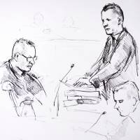 A court drawing shows accused Peter Madsen (left) and prosecutor Jakob Buch-Jepsen (standing) on Thursday, the first day of his trial in Copenhagen. Danish inventor Madsen says Swedish journalist died after toxic fumes filled submarine they were sailing in