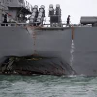 The U.S. Navy guided-missile destroyer USS John S. McCain is seen after it collided with Liberian-registered oil tanker the Alnic MC near Singapore on August 21, 2017. 'Sudden turn' into tanker's path by Yokosuka-based U.S. warship led to deadly 2017 collision: Singapore