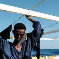 A 22-year-old Eritrean man is seen on the Proactiva Open Arms rescue ship after being rescued in the Mediterranean off Libya Sunday. TB death of Eritrean migrant in Italy points to dire, fatal conditions in Libya: aid workers