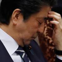 Prime Minister Shinzo Abe attends at an Upper House session in Tokyo on Wednesday. Abe's best chance for survival as LDP chief lies in his diplomatic skills