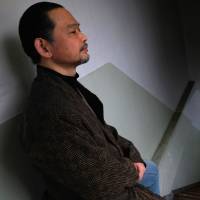Ikeida (not his real name), a 55-year Japanese who has chosen to shut himself completely away from society, poses for a picture in Tokyo on March 8. Japan's older <em>hikikomori </em>live in isolation, shunning society for years