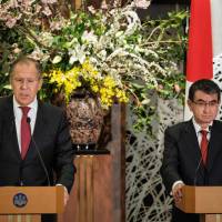 Foreign Minister Taro Kono (right) and his Russian counterpart Sergei Lavrov attend a news conference after a meeting at the Iikura House in Tokyo on Wednesday. Top diplomats from Japan and Russia meet in Tokyo, keen on promoting joint economic projects on disputed islands