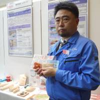 Kotobuki Giken President Seiichiro Takayama holds up mock organs made from tofu and konnyaku (devil’s tongue jelly) that his firm developed for young surgeons. Saitama medical device makers fill vital health care niche
