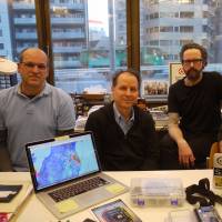 Members of global citizen-based radiation monitoring group Safecast (from left) Joe Moross, Azby Brown, Sean Bonner and Pieter Franken speak at their office in Shibuya, Tokyo, on March 2. Radiation monitoring group formed during Fukushima nuclear disaster now a source of global data