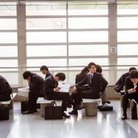 University students wait for the start of a job fair in the city of Chiba during last year’s recruiting season. A recent survey found that the majority of students don’t want their abilities to be judged by artificial intelligence, even as more companies rely on the technology. Majority of job-seeking university students put off by AI-powered candidate screening