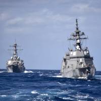 The MSDF Akizuki-class destroyer Fuyuzuki (right) cruises in formation with the Arleigh Burke-class guided-missile destroyer USS Curtis Wilbur in formation during a close quarters maneuvering exercise in the Philippine Sea on Feb. 28. The case for a new U.S.-Japan strategy: Why we need a free, open Indo-Pacific