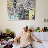 The personal touch: Chandru G. Advani sits at his home beneath a collage created for his 90th birthday by renowned artist Navin Rawanchaikul made up of 90 letters and other artifacts from Chandru’s life. Chandru G. Advani, 1924-2018: 'Uncle' to Japan's Indian community