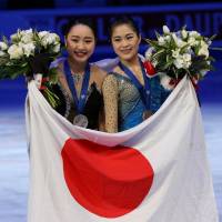 Wakaba Higuchi and Satoko Miyahara pose after claiming the silver and bronze medals at the world championships on Friday night. Kaetlyn Osmond wins world title; Wakaba Higuchi takes silver, Satoko Miyahara claims bronze