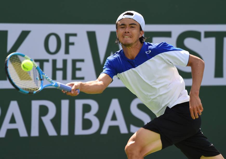 Taro Daniel hits a return during his match against Novak Djokovic at the BNP Paribas Open in Indian Wells, California, on Sunday. Taro Daniel stuns Novak Djokovic at Indian Wells
