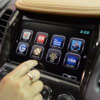 An attendee demonstrates the OnStar 4G LTE dash system on a Chevrolet Impala in Detroit on Jan. 13, 2014. Having lost the smartphone battle, Japan now lags on connected cars