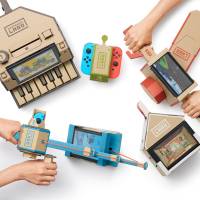 Cardboard accessories for the Switch console by Nintendo Labo are seen in a promotional photo. The build-it-yourself cardboard kits, with accompanying software, let users transform the Switch into a miniature piano, motorcycle handlebars, robot exoskeleton and other objects. Nintendo's $30 billion rally now depends on $70 cardboard pianos