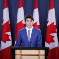 Canadian Prime Minister Justin Trudeau speaks during a news conference about the state of the Kinder Morgan pipeline expansion, in Ottawa on Sunday. Canada's Trudeau pledges funds and new law to ensure contentious pipeline is built