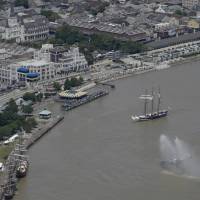 The Oosterschelde, a three-masted schooner from the Netherlands, makes its way to Woldenberg Park on the Mississippi River where two other tall ships, the SSV Oliver Hazard Perry (second from bottom left) and Picton Castle (bottom left), are docked in New Orleans Thursday. Tall ships salute 300th anniversary of New Orleans