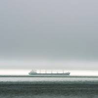 A freighter makes its way along the St. Lawrence River on Thursday. Negotiators hope to breathe life into Paris accord