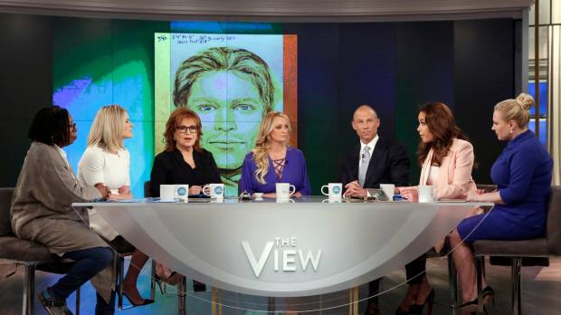 This image released by ABC shows (from left) co-hosts Whoopi Goldberg, Sara Haines, Joy Behar, adult film actress Stormy Daniels, her attorney, Michael Avenatti, co-hosts Sunny Hostin and Meghan McCain during an appearance on the daytime talk show “The View” Tuesday in New York. Daniels released a composite sketch of the man she says threatened her in a Las Vegas parking lot to stay quiet about her past sexual tryst with President Donald Trump. Avenatti says they are offering $100,000 for information leading to the man’s identification. Lawyer offers $100,000 to identify man Stormy Daniels says threatened her