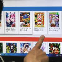 A man looks at one of Japan’s most notorious “leech sites,” which aggregate links to content that has been uploaded on other sites regardless of the legality. Internet piracy taking major bite out of Japan's famed manga culture