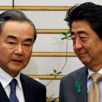 China’s top diplomat, Wang Yi, meets with Prime Minister Shinzo Abe during high-level bilateral economic talks in Tokyo on Monday. Trade war would threaten global growth, Japan and China agree in first economic talks since 2010