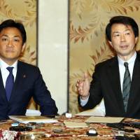 Kibo no To (Party of Hope) chief Yuichiro Tamaki (left) and Democratic Party leader Kohei Otsuka give a news conference at the Diet on Monday. Japan's Democratic Party and Kibo no To launch merger talks