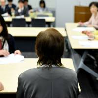 Junko Iizuka (center), who was sterilized at 16, speaks about her experience during a meeting with lawmakers in Tokyo on March 29. Lifetimes of pain: Victims of Japan's forced sterilization program hope for justice, or at least an apology