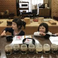 Stirring fun: To create the base scent for Yamada-Matsu’s Japanese incense sachets, eight different ingredients are spooned out from jars and mixed together. The sweet smell of an incense workshop success
