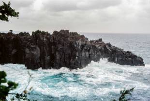 Rugged rocks: A torrid sea crashes against the jagged cliffs that jut out into 	Sagami Bay, Shizuoka Prefecture.