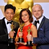Hollywood honor: Kazuhiro Tsuji (left), Lucy Sibbick and David Malinowski show off their Oscars at last month’s Academy Awards ceremony. His darkest hours behind him, Kazuhiro Tsuji returns to Hollywood and Oscar glory