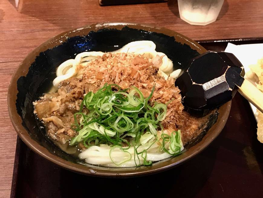 Kagawa Ippuku Kagawa Ippuku's niku udon: A clear, savory broth topped with beef and a generous mound of katsuobushi flakes compliments the perfectly chewy Sanuki udon. | ROBBIE SWINNERTON