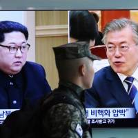 A South Korean soldier passes a TV screen in Seoul on April 18 showing North Korean leader Kim Jong Un and South Korean President Moon Jae-in. While North Korea declared this past weekend that it would stop nuclear and ICBM tests, and shut down its nuclear test site, it did not indicate it would give up its nuclear arsenal or halt its production of missiles. Two contradictory proverbs