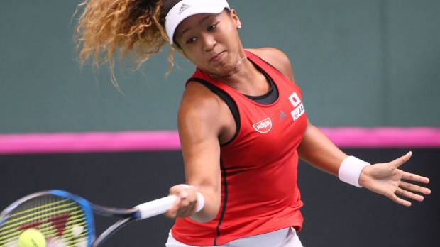 Japan’s Naomi Osaka hits a return to Britain’s Heather Watson in their Fed Cup World Group II playoff match on Saturday in Miki, Hyogo Prefecture. Japan, Britain tied in Fed Cup clash