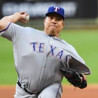 The Rangers’ Bartolo Colon pitches against the Astros during the first inning on Sunday in Houston. Bartolo Colon flirts with perfect game in win