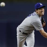 Los Angeles starter Kenta Maeda pitches against San Diego in the first inning on Wednesday night. Dodgers' Kenta Maeda earns victory with 10-strikeout performance