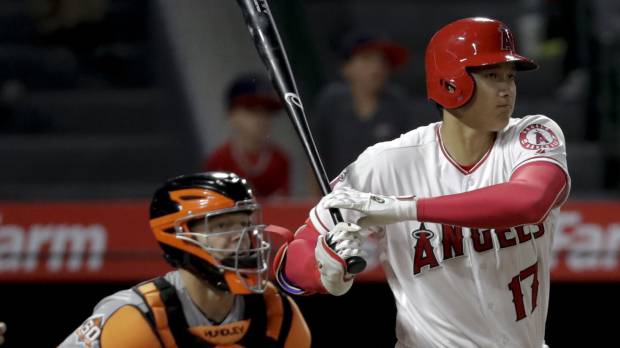 Los Angeles’ Shohei Ohtani raps out a single against San Francisco in the ninth inning on Friday night. Angels dealt fourth straight loss