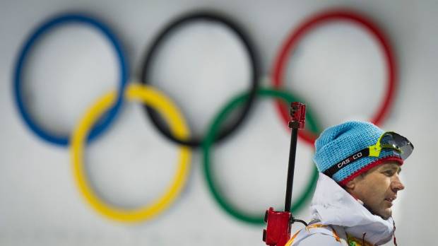 Norwegian biathlon star Ole Einar Bjoerndalen walks past the Olympic rings at the 2014 Sochi Winter Games. Sapporo declares official interest in hosting 2026 Winter Games