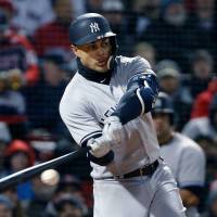 Giancarlo Stanton singles during the fifth inning of the Yankees’ game against the Red Sox on April 10, in Boston. Giancarlo Stanton slumping in Bronx with Yankees
