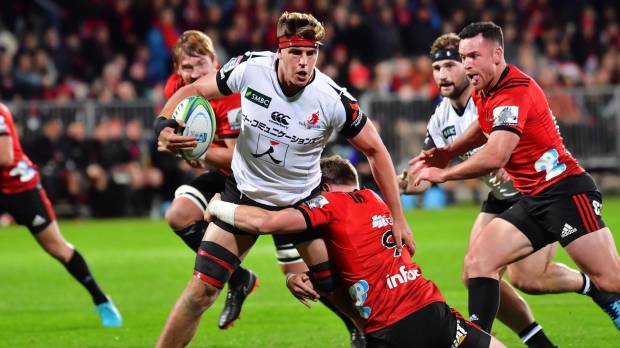 The Sunwolves’ James Moore is tackled by the Crusaders’ Mitchell Drummond during their match on Saturday in Christcurch, New Zealand. Sunwolves make two changes ahead match against Hurricanes