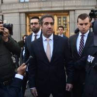U.S. President Donald Trump’s personal lawyer, Michael Cohen (center), leaves the U.S. Courthouse in New York on April 26. As Donald Trump’s longtime personal attorney, Michael Cohen earned a reputation as the “fixer” for the Manhattan real estate tycoon and a pit bull defender of his larger-than-life boss. Trump attorney's business scrutinized amid allegations of selling influence