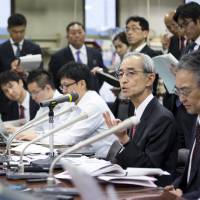 Nobuo Kuroyanagi, president and chief executive officer of Mitsubishi UFJ Financial Group Inc., addresses a news conference in Tokyo on May 15. Japan's earnings reports mostly disappoint, but analysts see hope ahead