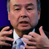 SoftBank Group Corp. Chairman Masayoshi Son speaks during the Wall Street Journal CEO Conference in Tokyo on Tuesday. SoftBank chairman Masayoshi Son risks U.S. security shackles with T-Mobile