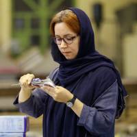 Managing Director Leila Daneshvar works at the KTMA factory in Tehran on May 17. Female Iranian manufacturer becomes victim of Trump's sanctions