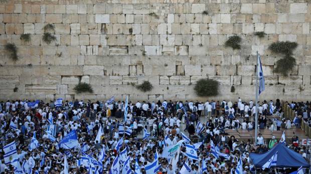Isreali nationalist settlers wave their national flags at the Western Wall in Jerusalem’s Old City on Sunday as they celebrate Jerusalem Day. For Israelis, Sunday is Jerusalem Day, an annual celebration of the “reunification” of the city following the 1967 Six-Day War. Mass protests in Gaza ahead of U.S. Embassy event in Jerusalem