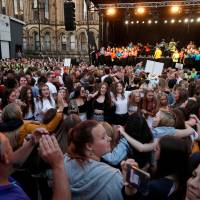 People attend a choir concert on the first anniversary of the Manchester Arena bombing in Manchester, Britain, Tuesday. 22 Manchester concert bombing fatalities remembered on first anniversary