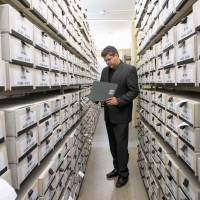 Jens Rommel, German prosecutor and head of the Central Office for the Investigation of National Socialist Crimes, stands in the archives room of the institution in Ludwigsburg, southwestern Germany, on April 19. German Nazi hunters in urgent race against time to track down last living war criminals