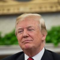 U.S. President Donald Trump looks on during a meeting with South Korean President Moon Jae-in in the Oval Office of the White House in Washington Tuesday. Nukes key to North Korea strategy, Pentagon reports, complicating Trump bid to get Kim to give them up