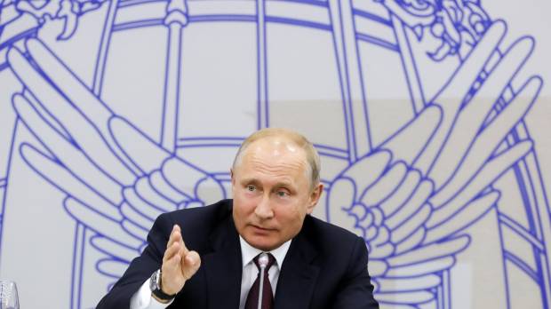 Russian President Vladimir Putin speaks during a meeting with heads of foreign companies the St. Petersburg International Economic Forum on Friday. Vladimir Putin says will step down as president after term expires in 2024