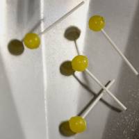 Lollipops spill out of a cooling machine at an Ohio factory. Sweet tooth? Brain-tinkering study makes sugar taste vile
