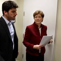 U.S. Sen. Jeane Shaheen (D-NH) walks with her aide on Capitol Hill in Washington last December. U.S. bill would force tech firms to disclose if foreign adversaries probed their sensitive software