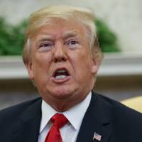 President Donald Trump speaks during a meeting with NATO Secretary-General Jens Stoltenberg in the Oval Office of the White House Thursday in Washington. A year into his investigation, special counsel Robert Mueller is everywhere and nowhere at the same time. In that time, the breadth and stealth of his investigation has rattled the White House and its chief occupant, and has spread to Capitol Hill, K Street, foreign governments and, as late as last week, corporate boardrooms. Trump: If FBI spied on my campaign, that would be 'bigger than Watergate!'