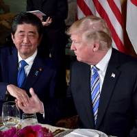 Prime Minister Shinzo Abe shakes hands with U.S. President Donald Trump during a dinner at Trump’s Mar-a-Lago estate in Palm Beach, Florida, on April 18. Abe to meet Trump at White House on June 7 ahead of possible U.S.-North Korea summit